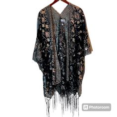 Kirks Folly Dreamkeeper Collection Enchanted Peacock Black With Gold Sequins Caftan/Wrap - One Size Fits Most Approximately 37 Inches Long With 7 Inch Fringe. Purchased New From Kirks Folly, But Never Worn. Made From 100% Polyestersheer Lightweight Material. Overall Color Is Black With Gold Sequins, But Some Embroidery Looks Silver. Please See Pictures For Details. Black Long Kaftan One Size, Bohemian V-neck Kimono For Party, Black Shawl Kimono For Spring, Black Bohemian Shawl For Spring, Black Bohemian Party Kaftan, Bohemian Black Party Kaftan, Elegant Summer Festive Kimono, Elegant Black Summer Shawl, Bohemian Evening Kaftan With Kimono Sleeves