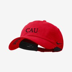 a red cap with the word cau printed on it and black lettering in front