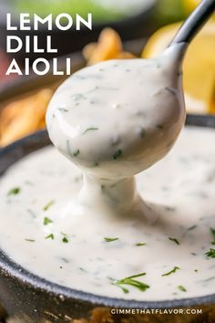 a spoon full of lemon dill aioli in a skillet