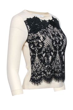 A festive or mysterious lace sweater by Diane von Furstenberg; you decide the mood with the occasion! This classic fit sweater pairs perfectly with cropped black pants and a black pump for a chic take on holiday party dressing, or with a leather pencil skirt for a look that is both pretty and edgy. Size P 90% Wool, 8% Nylon, 2% Spandex Combo 100% Nylon Lace overlay detail Ribbed back Bust 33" Waist 29" Shoulder to hem 20.5" Sleeve length 19.5" Elegant Crew Neck Sweater For Party, Elegant Crew Neck Lace Top With Lace Trim, Chic Crew Neck Lace Top For Fall, Chic Lace Crew Neck Top For Fall, Elegant Black Tops With Contrast Lace, Elegant Stretch Sweater For Party, Elegant Black Lace Top For Layering, Elegant Black Sweater For Evening, Elegant Evening Sweater With Crew Neck