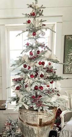 a decorated christmas tree in a bucket