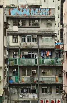 an apartment building with balconies and balconyes in the middle of a city