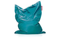 a large green bag sitting on top of a white floor