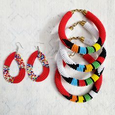 These beautiful Maasai beaded Earrings will make you look your very best wherever you go. Beautiful, hand beaded earrings are handmade by Maasai women artisan in Kenya These traditional earrings have become very popular over the years and can be worn from casual and formal events year round. Note: As with all handcrafted products colours, design patterns and size my very. Note: Bracelet sold separately Handmade in Kenya Drop length: 3 Inches Materials: Maasai beads Closure: Ear wire Handwoven Beaded Bracelets With Round Beads, Traditional Beaded Hoop Earrings, Traditional Beaded Hoop Earrings For Festive Occasions, Traditional Festive Beaded Hoop Earrings, Festive Multicolor Beaded Hoop Earrings, Handmade Traditional Multicolor Hoop Earrings, Handmade Multicolor Traditional Hoop Earrings, Traditional Handmade Multicolor Hoop Earrings, Adjustable Round Beaded Earrings For Festive Occasions