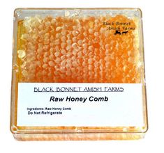 raw honey comb from black bonnet amish farms is shown in the box on a white background