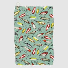 a teal towel with fishing lures on it