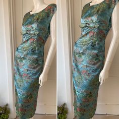 Vintage 1950s Chinese silk jacquard cocktail dress Stunning Ice blue silk with golds, greens and pinks. Fabulous classic 1950s cocktail dress, tailor made possibly in Hong Kong. Beautifully made, heavy silk jacquard. fitted through the body with fabulous stand out pockets!! Central zipper at the back. Size roughly UK 8 Measures Across shoulders-19in pit-pit-19in across waist-15in across hips-17in length shoulder-waist-16in waist-hem-29in length shoulder-hem-45in condition Excellent Green Brocade Party Dresses, Green Brocade Dress For Formal Occasions, Green Brocade Formal Dress, Formal Green Brocade Dress, Vintage Brocade Party Dress, Fitted Brocade Cocktail Dress, 1950s Style Formal Silk Dress, 1950s Style Silk Cocktail Dress, 1950s Silk Cocktail Dress