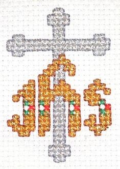 the cross is made up of beads and some other things in gold, silver, and red