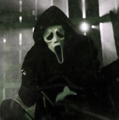 a person in a ghost mask with their mouth open