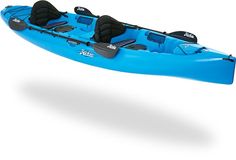 a blue kayak floating on top of a white background