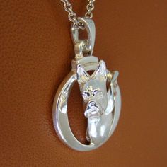 Please read. The following information should answer all your questions about this pendant. Breed-specific jewelry is a novel way to show off your favorite dog breed, it also makes a great present for the dog lovers on your gift list. In my many years of making and selling breed-specific jewelry I have heard more times that I can count that, it becomes the wearers favorite piece of jewelry. My pendants are made with a very high-quality solid sterling silver. I put a satin finish on the breed stu Sterling Silver Rose Gold Memorial Jewelry, Sterling Silver Custom Necklace With Round Pendant, Sterling Silver Round Pendant Necklace With Polished Finish, Custom 14k Gold Necklace With Polished Finish, Circle Frame, Circle Frames, Gift List, A Circle, A Novel