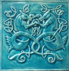 a blue tile with an intricate design on it