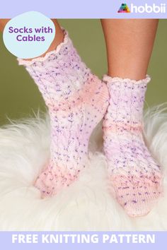 there is a pair of socks that are knitted in pink and purple colors, with the words socks with cables on it