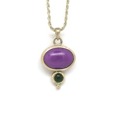 This gorgeous pendant is one of a kind. I'm not sure what the purple stone is but the little green stone is a tourmaline. The color in the pictures is pretty accurate. I would call the purple stone a warm lavender and the green stone has a strong blue component. This pendant is constructed by hand with heavy hammer set silver bezels, not the flimsy ones you find on costume jewelry. This necklace will stand the test of time. Luckily the simply elegant shape and profile will never go out of fashio Purple Cabochon Pendant Jewelry, Purple Cabochon Round Pendant Jewelry, Green Amethyst Oval Jewelry, Green Oval Amethyst Jewelry, Purple Oval Cabochon Gemstone Jewelry, Oval Purple Necklaces With Natural Stones, Purple Oval Cabochon Necklaces, Purple Oval Cabochon Necklace, One Of A Kind Purple Pendant Jewelry