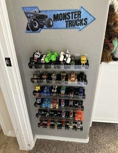 there is a monster truck display on the wall