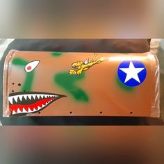 a plastic box with an image of a shark and a star on it