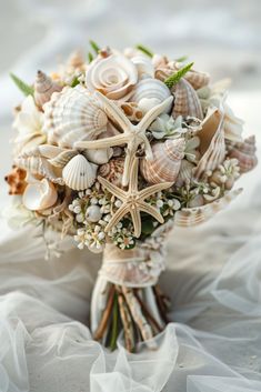 a bridal bouquet with seashells and starfish