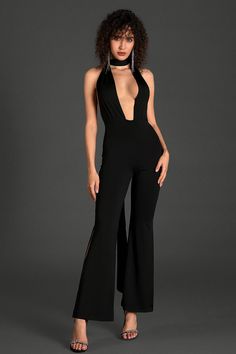 Grace the occasion in our hollow backless jumpsuit, a captivating ensemble designed to elevate your style with grace and sophistication. This jumpsuit features intricate hollow back detailing and draped ribbon, adding a touch of allure to your wardrobe. Handmade customization Fabric composition: 90% polyester fiber, 10% spandex Washing method: hand wash or dry clean Popular elements: hollow Elegant V-neck Party Bodysuit, Backless Strapless Jumpsuit For Summer Formal, Summer Formal Backless Strapless Jumpsuit, Backless Jumpsuits And Rompers For Party, V-neck Tie Back Jumpsuit For Party, Elegant Solid Color Backless Strapless Jumpsuit, V-neck Party Jumpsuit With Tie Back, V-neck Jumpsuit With Tie Back For Party, Elegant Sleeveless Jumpsuits And Rompers For Party