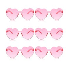 pink heart shaped glasses are lined up against a white background