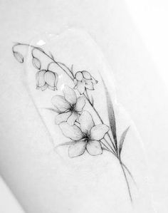 a small tattoo with flowers on it