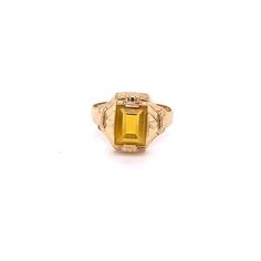 Vintage 1940's 10k yellow gold yellow stone ring. The ring size is a loose 9, and can be resized. The height of the ring off of the finger is 3.9mm. The width of the band is 3.7mm, and tapers down to 2.8mm. Yellow Topaz Center Stone Ring In 14k Gold, Vintage 14k Gold Signet Ring With Center Stone, Vintage Gold Engraved Ring With Center Stone, Art Deco Gold Sapphire Ring In 14k Gold, Gold Art Deco Sapphire Ring In 14k Gold, Art Deco 14k Gold Sapphire Ring, Yellow Topaz Promise Ring In 14k Gold, Vintage Yellow Gold Signet Ring With Center Stone, Vintage 14k Yellow Gold Emerald Ring