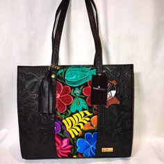 Brand New W/Tags! Angelozano Chisel Engraved Black Leather Tote With Floral Loom Work! Premier Mexican Designer Angelozano Produces Bags That Are Hand Made And Support Fair Trade Artisans. The Artisans Express Their Emotions And Feelings In The Looms, And When We See Them, They Transmit To Us A Part Of Their Life, Their Environment And Their Culture, That Is Why All The Looms Are Different Just As Our Personality Is Unique. By Using This Original Bag You Are Carrying A Unique And Unrepeatable Wo Artisan Black Bag With Leather Handles, Artisan Black Bags With Leather Handles, Black Hand Tooled Tote Bag, Black Hand Tooled Bags For Everyday Use, Artisan Black Tote Shoulder Bag, Black Hand Tooled Tote Shoulder Bag, Black Hand Tooled Rectangular Shoulder Bag, Black Hand Tooled Shoulder Bag For Everyday, Traditional Black Shoulder Bag With Leather Handles