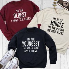 Humorous Siblings Rules Sweatshirts, Oldest Middle Youngest Funny Siblings Hoodie, Matching Family Tees,  Sister Brother Birthday Shirt Show off your sibling pride with our Humorous Sweatshirt collection, featuring Siblings Rules Sweatshirts for every family member! Whether you're the Oldest Hoodie wearer, the Middle Hoodie champion, or the Youngest Hoodie star, these Funny Siblings Shirts are perfect for adding laughter to your family gatherings. Perfect for Matching Family Tees, this collectio Oldest Middle Youngest, Siblings Shirts, Funny Siblings, Funny Sibling Shirts, Sweatshirt Collection, Matching Hoodies, Sibling Rivalry, Sibling Shirts, Sibling Gifts