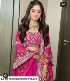 a woman in a pink lehenga and matching jewelry is posing for the camera