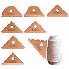 six pieces of wood that are shaped like pyramids and with holes in the middle