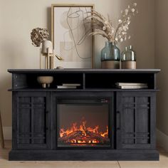 an entertainment center with a fireplace in the middle