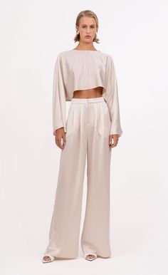 Our Paris Pant is a high-waisted, wide-leg pant made from 100% polyester. Simple, yet elegant the silky look elevates the overall appearance of the pant. The small touches such as pleats and the front zipper closure make them all the more unique. Nye Outfits, Pants Large, Denim Jumpsuit, Hat Hairstyles, Holiday Outfits, Sweater Jacket, Trousers Women, Front Zipper, Wide Leg Pants