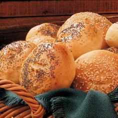 bread rolls in a basket on a table