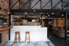 two stools sit in front of the bar