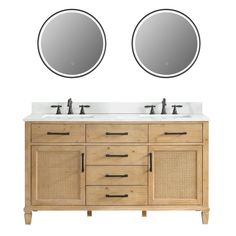 two round mirrors are above the double sink vanity