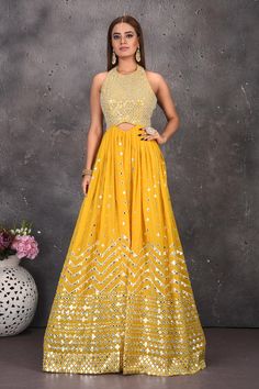 Buy stunning yellow halter neck mirror work jumpsuit online in USA. Look stylish at parties and wedding festivities in designer dresses, Indowestern outfits, Anarkali suits, wedding lehengas, palazzo suits, sharara suits from Pure Elegance Indian clothing store in USA.-full view Luxury Yellow Traditional Wear With Mirror Work, Yellow Mirror Work Party Dress, Yellow Floor-length Sets With Mirror Work, Yellow Halter Neck Maxi Dress, Yellow Halter Neck Sleeveless Dress, Work Jumpsuit, Jumpsuit Online, Fashion Journals, Anarkali Suits