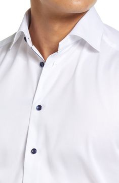 This sharp dress shirt is cut in a contemporary fit from high-performance, crease-resistant cotton twill. Blue buttons and coordinating piping in the placket provide handsome finishing touches. French placket Spread collar with permanent stays Long sleeves with mitered, adjustable button cuffs Back yoke Darts at the back to adjust the width Curved hem 100% cotton Machine wash, dry flat Imported Men's Furnishings Modern Dress Shirt With Placket, Modern Dress Shirt With Placket For Office, Classic Fitted Shirt With Buttons, Fitted Shirt With Functional Buttons For Work, Modern Semi-formal Shirt With Placket, Modern Fitted Dress Shirt With Button Closure, Modern Fitted Dress Shirt With Button Cuffs, Modern Fitted Dress Shirt, Modern Tailored Dress Shirt With Spread Collar