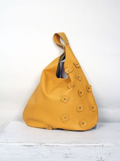 Soft Leather Bag - handbag made of Italian leather. The hobo bag can be carried as a shoulder bag. The spacious interior provides space for all everyday things and more. This bag is perfect as an everyday bag that can fit your iPad, A4 files, books, magazines, cosmetics as well as many accessories. -Yellow leather hippie bag . -Cowchide leather. - Inner pocket with zipper - Magnet closure bag DIMENSIONS: Height from top of handle to base: 66cm (26inches) Width at its widest point: 49cm (19.2inch Simple Leather Bag, Yellow Shoulder Bag, Yellow Purse, Soft Leather Purse, Yellow Purses, Large Leather Bag, Leather Bag Pattern, Soft Leather Bag, Hippie Bags