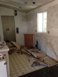 an unfinished kitchen with tile flooring and walls being built in the process of remodeling