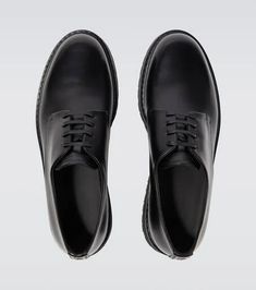 Giorgio Armani elevates these Derby shoes with a distinct platform rubber sole. Made in Italy from black leather, the lace-up style has a rounded toe and logo lettering on the tongue..Sole: leather insole, rubber sole.Toe shape: round toe.Upper: leather.Comes with a box, Comes with dust bag.Designer color name: Nero.Closure: lace-up.Made in Italy.True to size.Half sizes please take the next size up.UK sizes.5,0cm-2' heel (size EU 42) Formal Dress Shoes With Lug Sole And Round Toe, Classic Low-top Lace-up Shoes With Lug Sole, Formal Low-top Leather Shoes With Lug Sole, Formal Oxfords With Lug Sole And Round Toe, Formal Leather Shoes With Lug Sole And Round Toe, Formal Calf Leather Lace-up Shoes With Lug Sole, Formal Leather Shoes With Lug Sole, Elegant Calf Leather Lace-up Shoes With Lug Sole, Elegant Lace-up Shoes With Lug Sole In Calf Leather