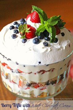 berry trifle with whipped cream and fresh berries on top