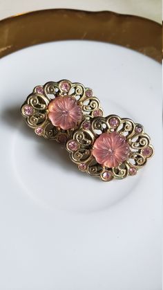 Beautiful pair of vintage clip on earrings with pink floral stones. Would make a lovely gift or addition to anyone's collection of vintage earrings. Vintage Flower Clip-on Earrings For Wedding, Pink Flower-shaped Clip-on Earrings, Pink Flower Clip-on Earrings, Victorian Pink Brooches For Wedding, Pink Clip-on Flower Earrings For Gift, Vintage Flower Earrings For Wedding, Elegant Pink Flower Clip-on Earrings, Elegant Pink Flower-shaped Clip-on Earrings, Pink Flower Shaped Clip-on Earrings For Wedding