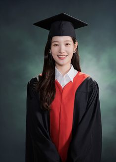 a woman wearing a graduation cap and gown