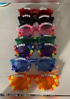 several pairs of colorful sunglasses are on display