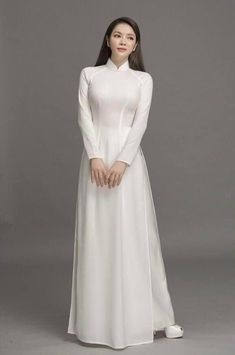 Brand New High Quality Vietnamese Ao Dai. Fast/Free Priority shipping (1-3 days delivery) via USPS. Size Bust/Chest Waist S33in/84cm27in/69cm M34in/86cm28in/71cm L35in/89cm30in/76cm XL37in/94cm32in/81cm 2XL 39in/99cm34in/86cm 3XL 41in/104cm 36in/91cm 4XL 42in/107cm 37in/94cm 5XL 44in/112cm40in/102cm 6XL 45in/114cm41in/104cm Ao Dai length is 56.0in Pants Length is 43.5in Please provide Bust, Waist, and Hip measurements as well as the Arm Circumference when placing your order so we can ensure the Luxury Silk Fitted Ao Dai, Ao Dai Dresses, Soe Myat Thu Zar Myanmar Dress, Dress With Pants, Ao Dai Vietnamese, Vietnamese Ao Dai, Vietnam Dress, Double Layer Dress, Girls Long Dresses