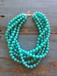 "Bright turquoise beaded necklace featuring 5 strands of lightweight lucite beads. This 5 strand statement necklace style is known as the Sylvie Necklace. Beads are shiny translucent and marbled finish in that great retro look & they were made in the 1960's. Necklace measures 15.5-16\" at it's shortest + a 6\" extender. Lightweight and fun to wear: a classic style that will outlast trends. Most all jewelry is hand finished & designed here in the US. Jewelry parts are salvaged as leftover Turquoise Beaded Necklace, Shine Jewelry, Everyday Earrings Studs, Padlock Necklace, Beads Craft Jewelry, Bright Turquoise, Necklace Beads, Turquoise Bead Necklaces, Labradorite Necklace