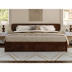 a large bed sitting in a bedroom on top of a wooden floor next to two nightstands