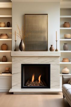 a living room with a fire place and shelves