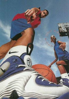 an advertisement for nike shoes featuring two basketball players in blue and white outfits, one with his foot on the basket