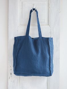 LINEN TOTE BAG The perfect solution for your Home Textile or Wedding gift - comfy, soft & cozy linen tote bag! ● Material: Premium quality 100% European stonewashed linen Linen fabrics meet OEKO-TEX 100 standards Fabric weight : +/ - 185 g/m2 (gsm) ● Color in picture: Denim Blue ● Please choose any other color on the right ● Stonewashed soft natural linen ● Dimensions: H 51 cm / 20'' W 39 cm / 15,3'' bottom 15 cm / 6'' bags strap 71 cm / 27,9'' Care: machine wash gentle 40 C/ 104 F Recommend Organic Bag, Linen Tote Bag, Linen Fabrics, Top Handbags, Yoga Bag, Linnet, Linen Bag, Linen Shop, Reusable Grocery Bags