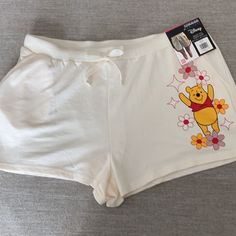 Disney Ivory (Off White) Winnie The Pooh Dolphin Shorts. 2 Front Pockets. Elastic Waistband With Drawstring. Size Xxl. Nwt. Waist Measures Approx 37 Inches. Rise Measures Approx 12.5 Inches. Inseam Measures Approx 2.25 Inches. White Playful Relaxed Fit Bottoms, Summer Cartoon Print Loungewear Bottoms, White Cartoon Print Bottoms For Loungewear, White Cartoon Print Bottoms For Summer, Cute Cartoon Print Shorts, Playful White Bottoms With Cartoon Print, Disney Shorts, Dolphin Shorts, Winnie The Pooh